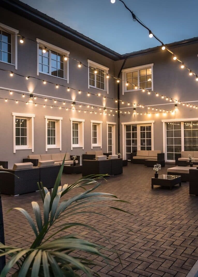The Grand Vila courtyard lit with festoon lights