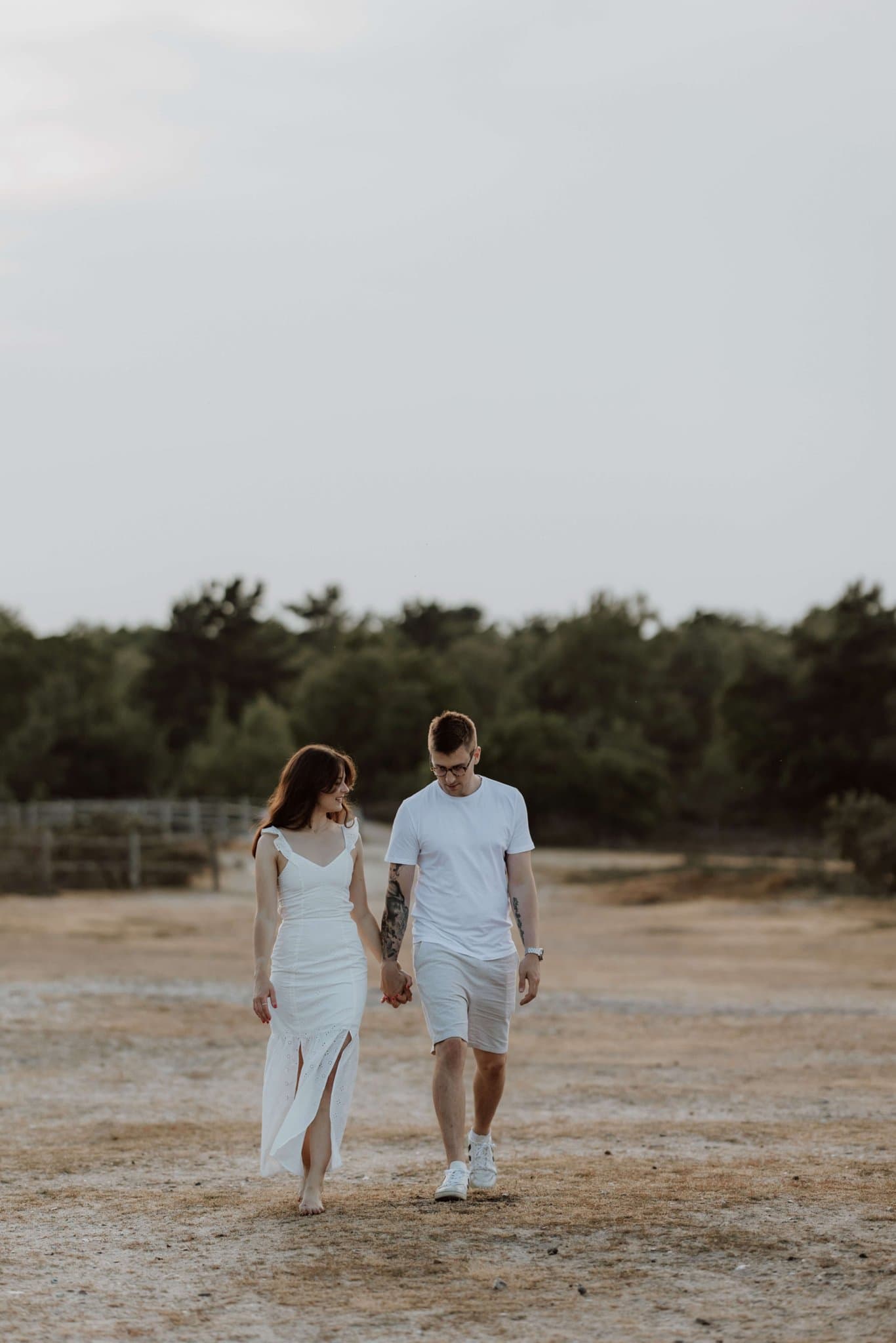 Ed and Migle walking hand in hand